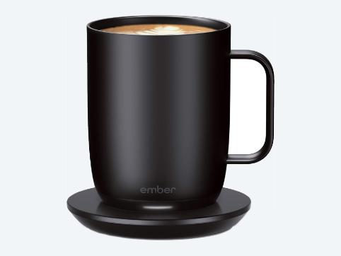 A black Ember temperature control smart mug filled with coffee